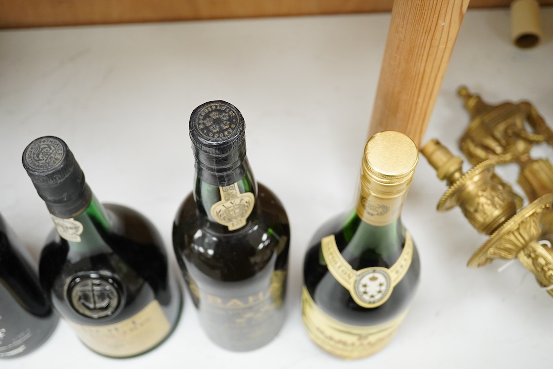Five bottles of port and brandy, including a bottle of Dow’s 1980 bottle of port